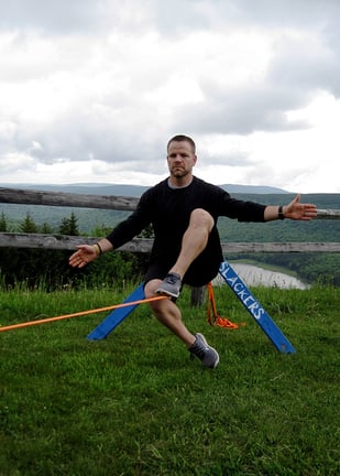 YogaSlackers-_-Day-1-_-Tony-sitting-on-slackline-Photo-2.jpg